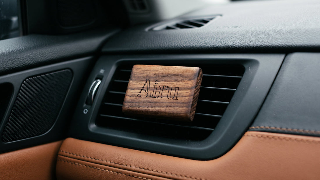 Airu wooden car diffuser attached to a car air vent